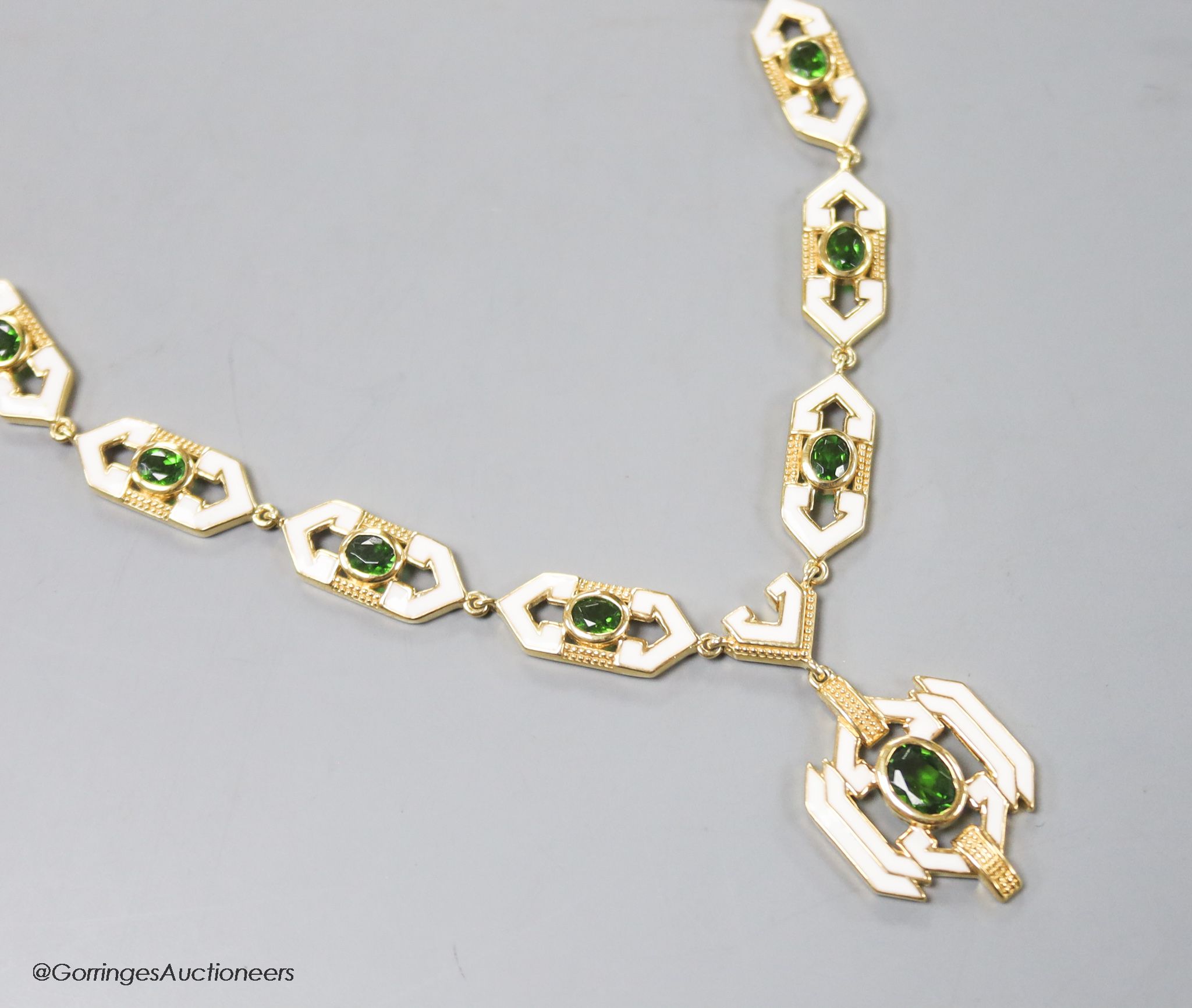 A modern stylish 925 gilt white metal, green paste and enamel set necklace, 50cm